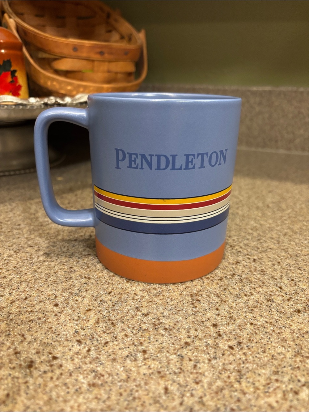 Pendleton Light Blue Ceramic Mug with Orange Base and Multi Stripes coffee latte
